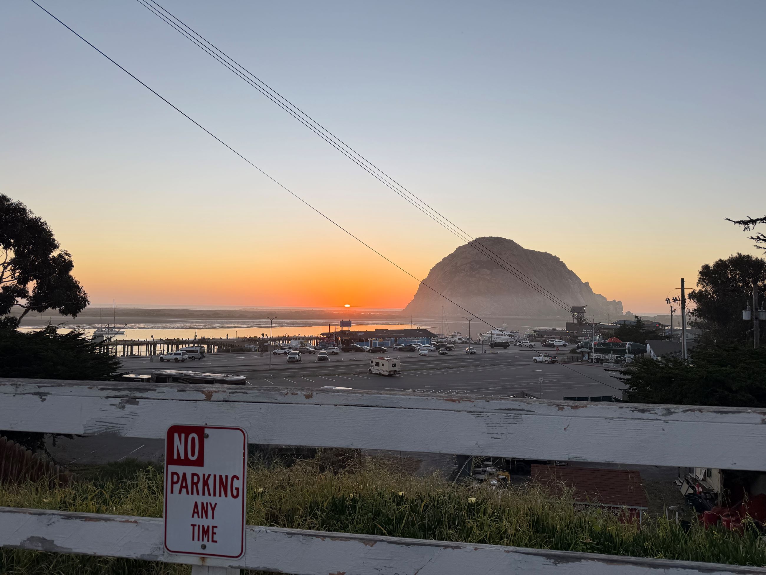 Image of Morro Rock from top of Surf St at sunset